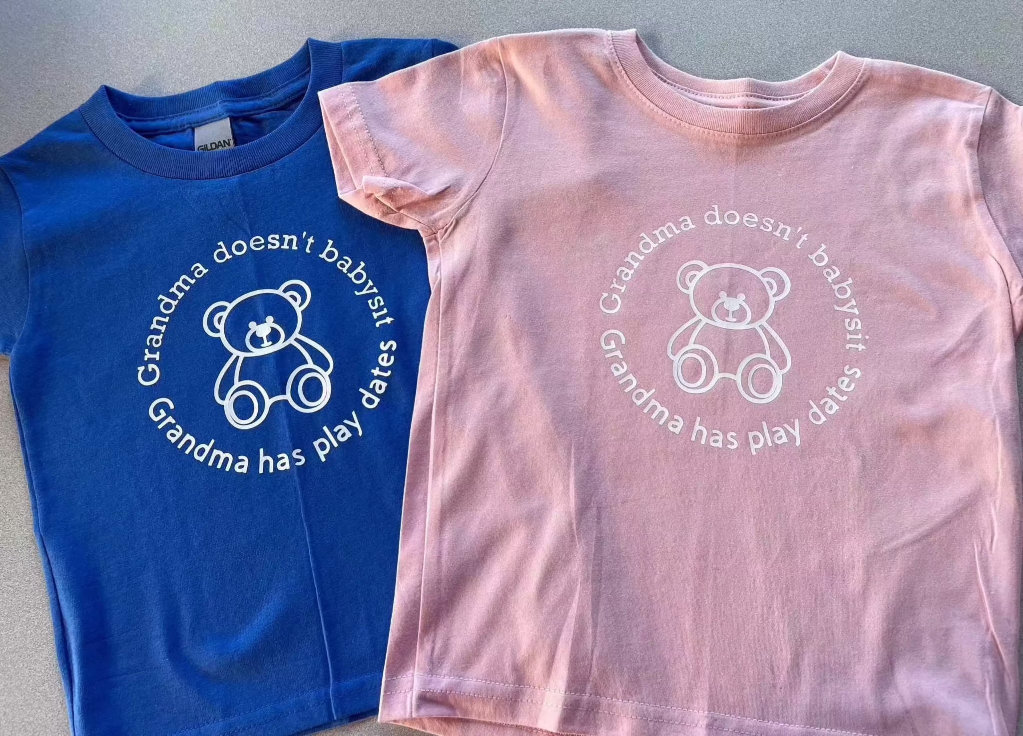 Toddler tees in blue and pink with teddy bear and "Grandma has play dates" text for toddlers 3T-4T