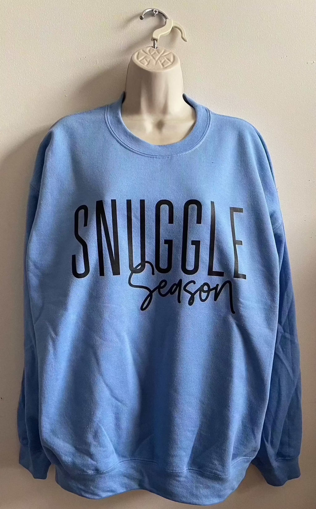 Blue Gildan cotton crewneck sweatshirt with Snuggle Season text for cozy warmth