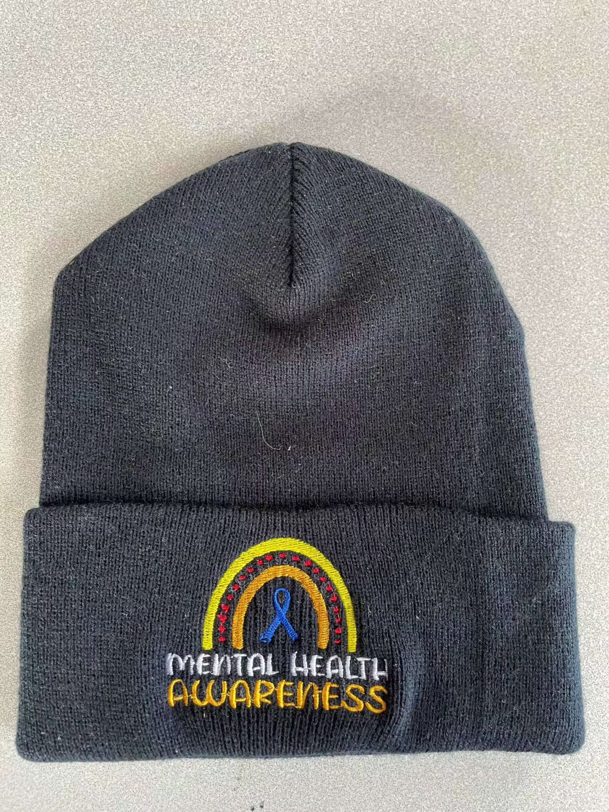 Warm knit hat with embroidered mental health awareness logo in black color