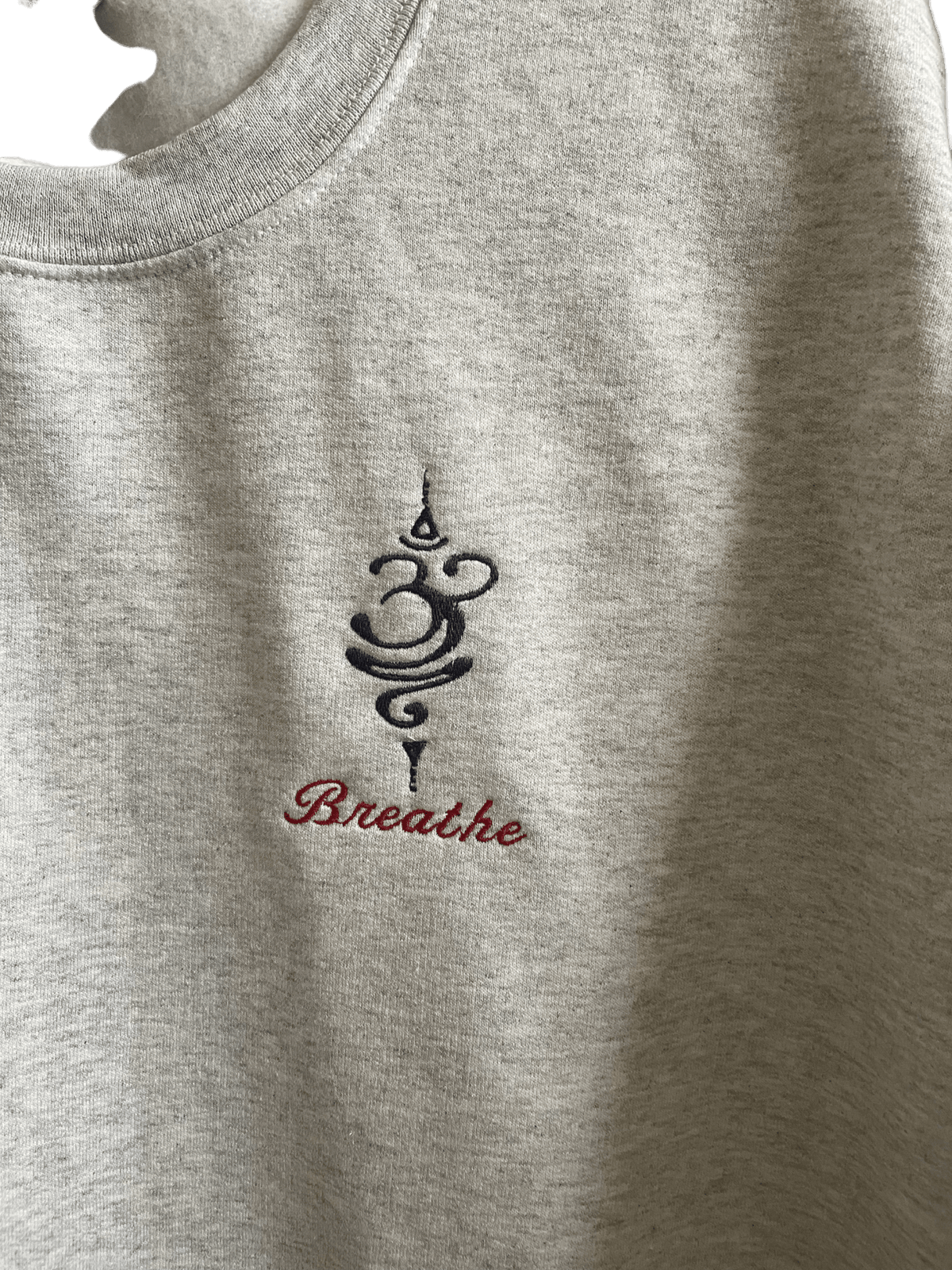 Breathe Grey cotton crewneck sweatshirt with embroidered design and text on soft fabric