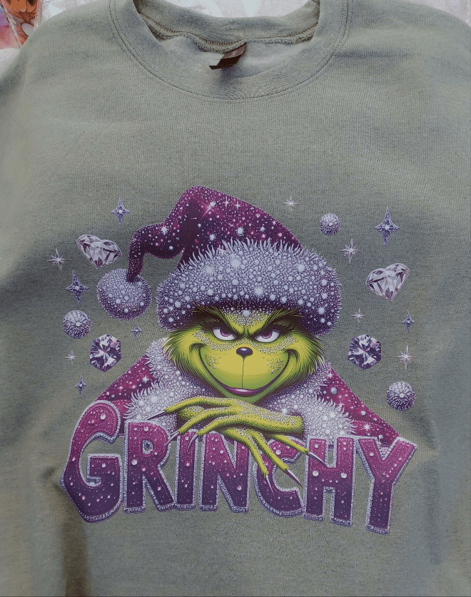 Grinchy green sweatshirt with festive Grinch design and purple accents