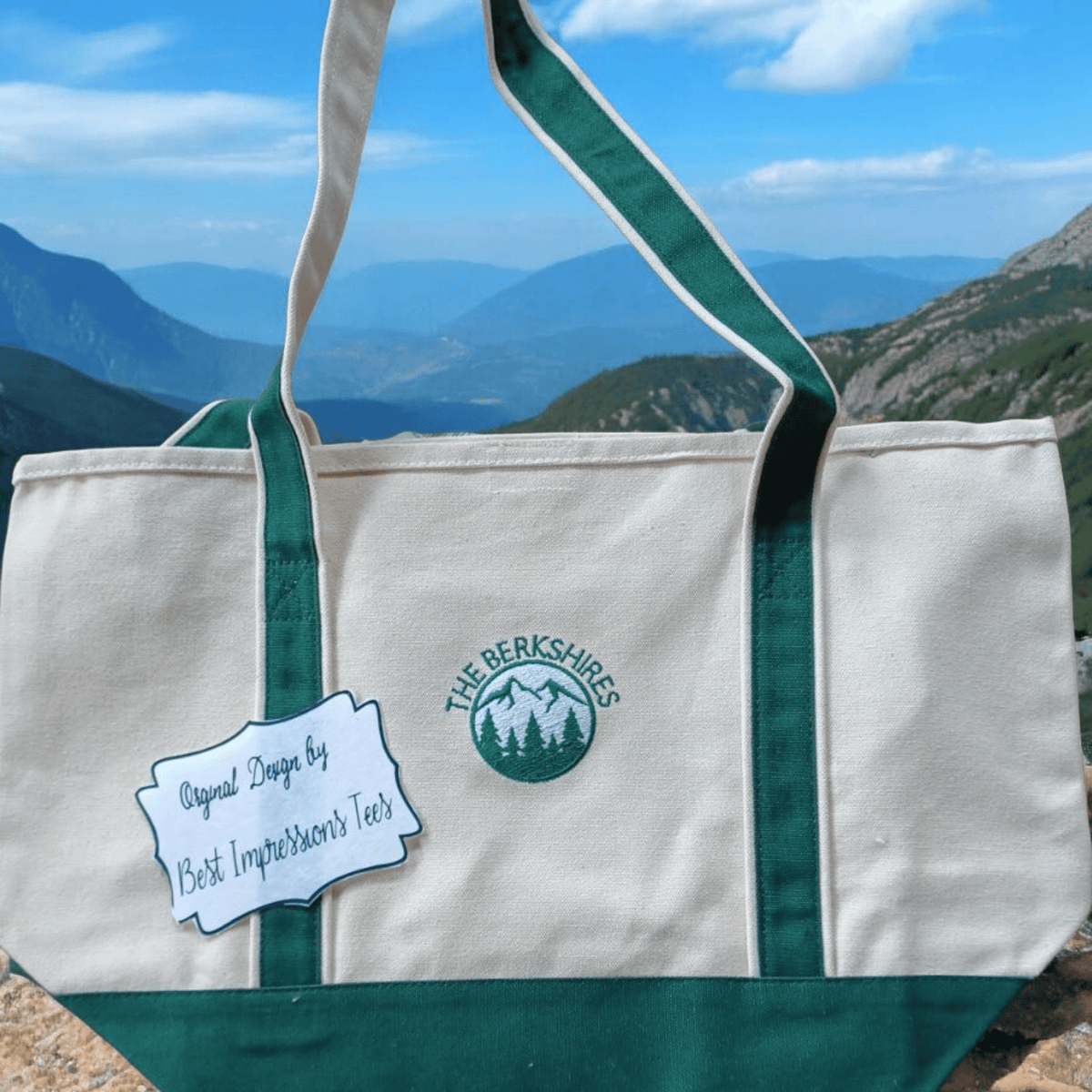 Large green trim tote bag embroidered with The Berkshires logo ideal for beach and travel use