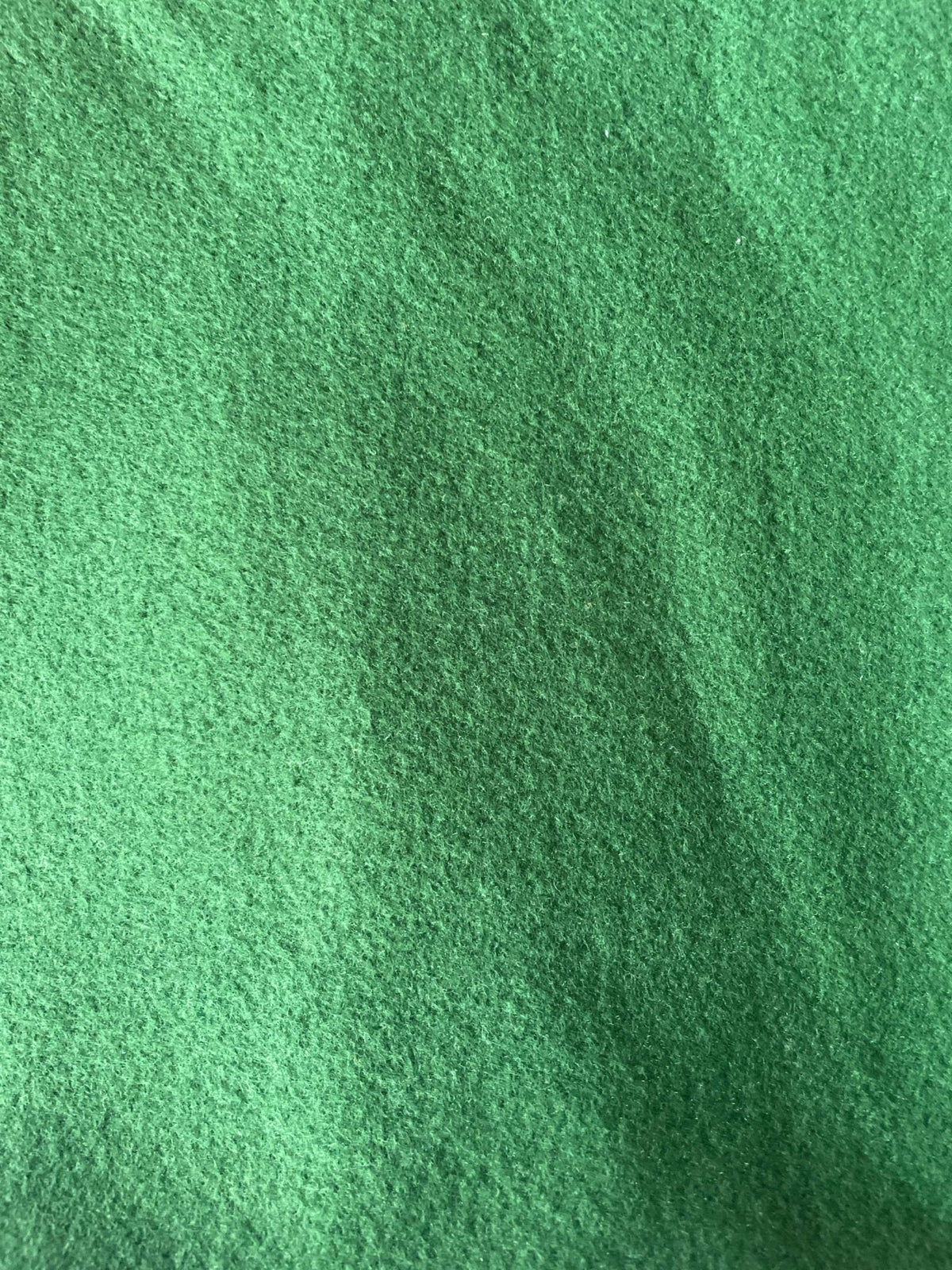Green fleece fabric texture of Varsity Fleece Neck Warmer for cold weather sports